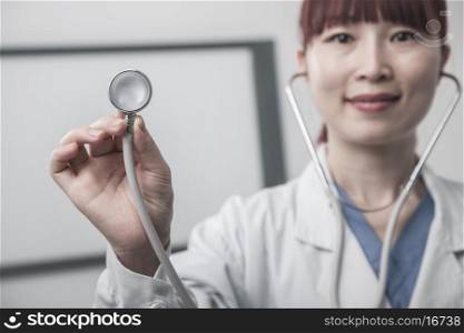 Portrait of female doctor holding a stethoscope