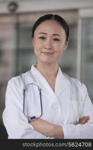 Portrait of female doctor with arms crossed outside of the hospital