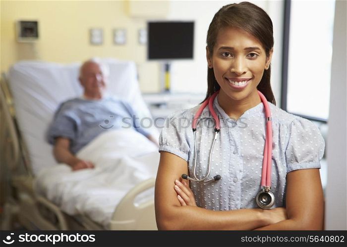 Portrait Of Female Doctor With Patient In Background