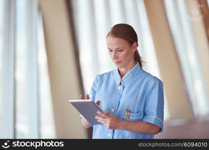 portrait of female doctor with tablet computer at hospital