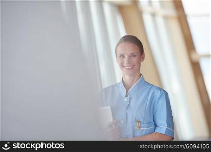portrait of female doctor with tablet computer at hospital