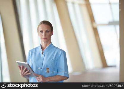 portrait of female doctor with tablet computer at hospital