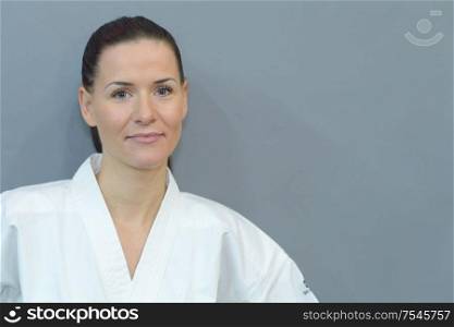 portrait of female fighter on grey background