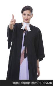 Portrait of female lawyer giving thumbs up