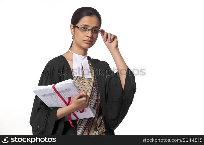 Portrait of female lawyer holding documents isolated over white background