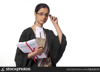 Portrait of female lawyer holding documents isolated over white background