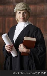 Portrait Of Female Lawyer In Court Holding Brief And Book
