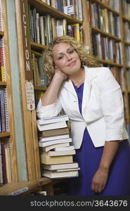 Portrait of female librarian by bookshelf