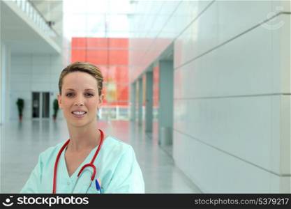 portrait of female nurse in hospital corridor