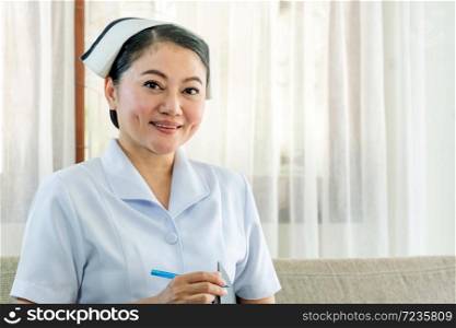 Portrait of female nurse working in hospital. Woman healthcare worker with clipboard. Hospital, health, care, Nurse Concept. Copy Space.