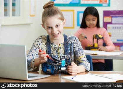 Portrait Of Female Pupil In Science Lesson Studying Robotics