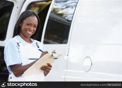 Portrait Of Female Repair Person With Van