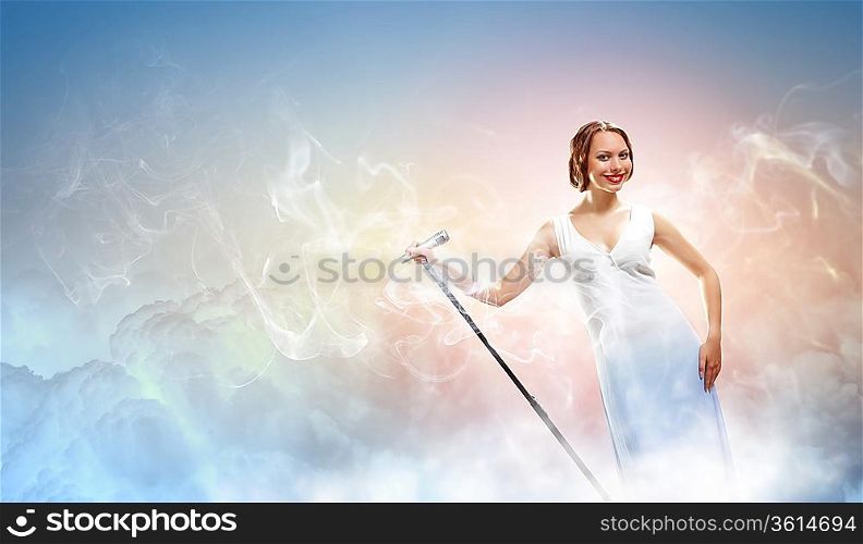 Portrait of female rock singer with microphone
