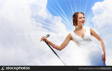 Portrait of female singer. Portrait of female rock singer with microphone