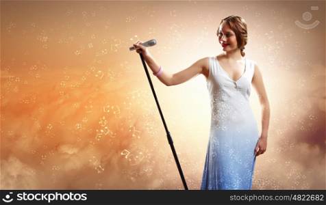 Portrait of female singer. Portrait of female rock singer with microphone