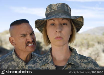 Portrait of female soldier and commander