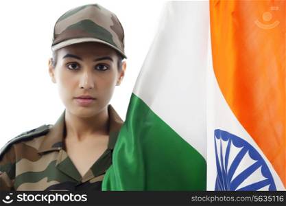Portrait of female soldier with Indian flag against white background