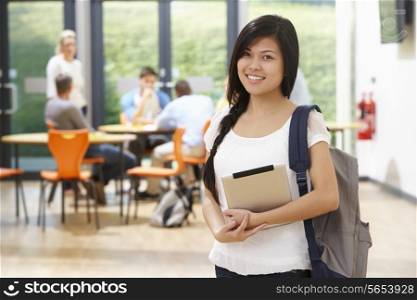 Portrait Of Female Student In Classroom With Digital Tablet