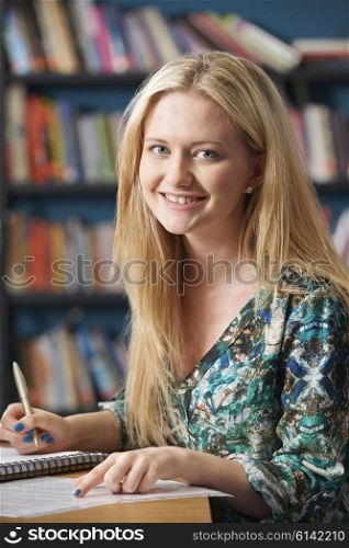 Portrait Of Female Student Working In Library