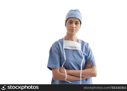 Portrait of female surgeon with arms crossed isolated over white background