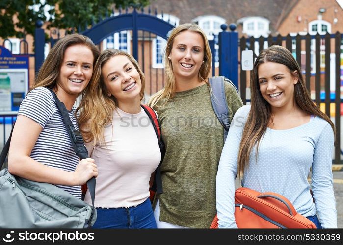 Portrait Of Female Teenage Students Outside School Building