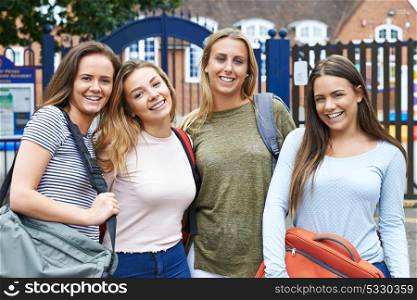 Portrait Of Female Teenage Students Outside School Building