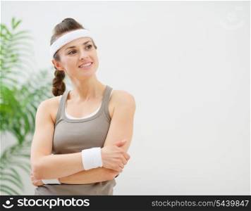 Portrait of fitness woman looking on copy space