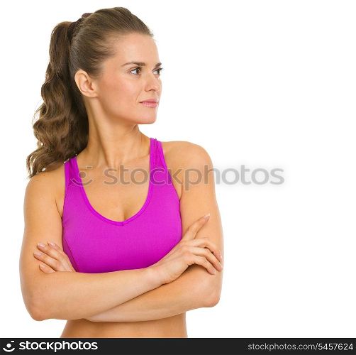 Portrait of fitness young woman looking on copy space