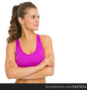 Portrait of fitness young woman looking on copy space