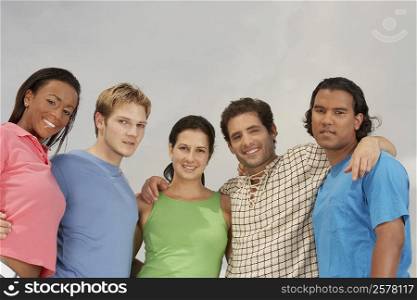 Portrait of five friends standing and smiling