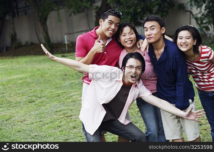 Portrait of five people looking cheerful