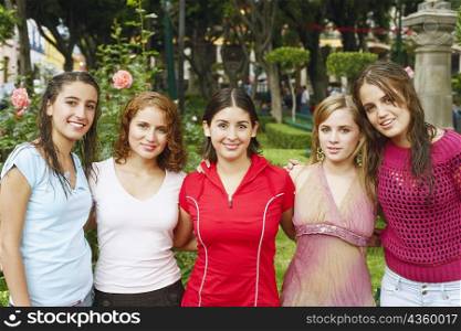 Portrait of five young women in a garden
