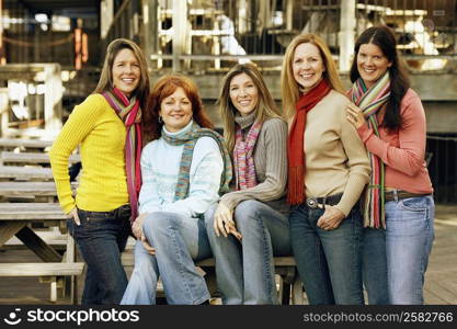 Portrait of five young women smiling