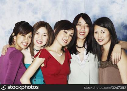 Portrait of five young women smiling
