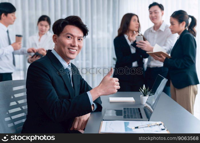 Portrait of focus young successful confident male manager, executive wearing business wear in harmony office arm crossed with blurred meeting background of colleagues, office worker.. Portrait of focus successful confident male manager in harmony office.