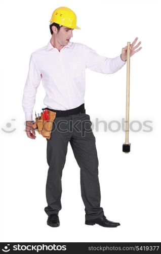 portrait of foreman dropping hammer isolated on white