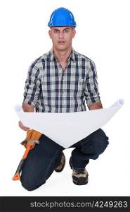 portrait of foreman holding blueprints