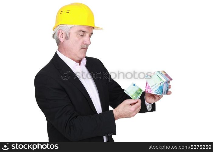 portrait of foreman holding money box