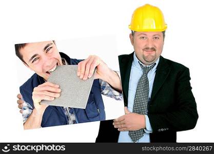portrait of foreman holding picture of young tiler