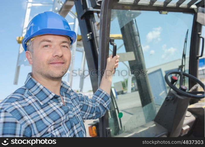 Portrait of fork lift driver