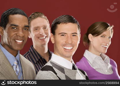 Portrait of four business executives smiling