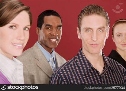 Portrait of four business executives smiling