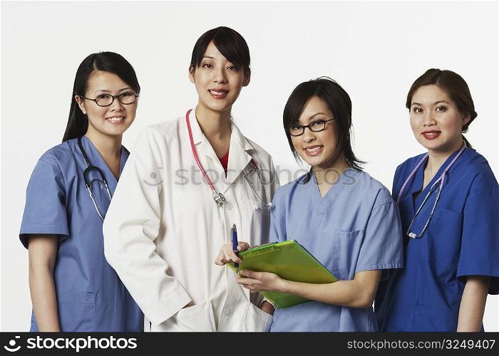 Portrait of four female doctors standing together
