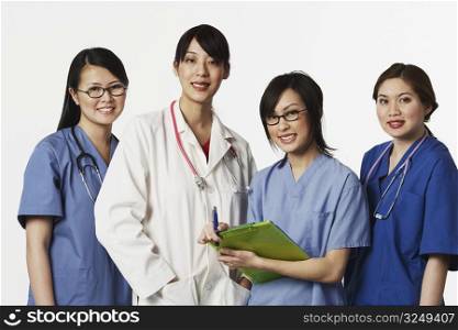 Portrait of four female doctors standing together