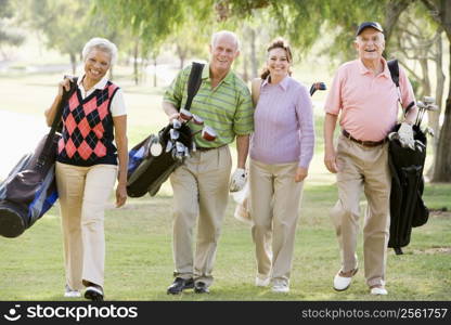 Portrait Of Four Friends Enjoying A Game Golf