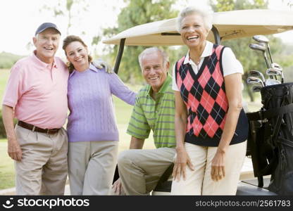 Portrait Of Four Friends Enjoying A Game Golf