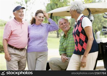 Portrait Of Four Friends Enjoying A Game Golf