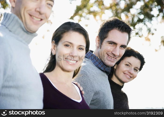 Portrait of four friends smiling