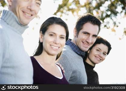 Portrait of four friends smiling