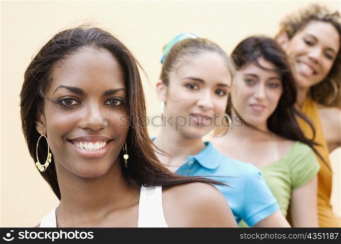 Portrait of four teenage girls smiling